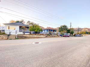 Front view of the home, offering a glimpse of the surrounding area and potential for your personal touch