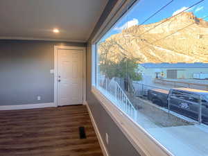 Living room with a new window showcasing stunning mountain views