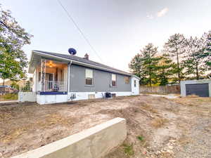 Side of the property features a porch, a new central AC unit, and a garage