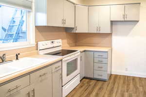 Kitchen with white range and an area for a refrigerator