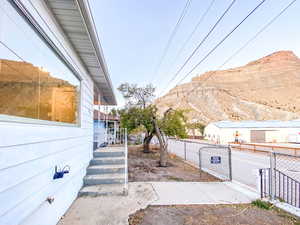 Steps leading to the front door, featuring a mountain view