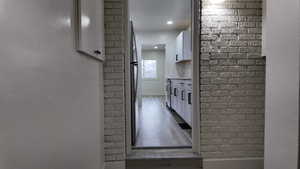 Hallway with dark wood-type flooring