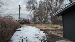 View of yard layered in snow