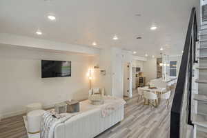 Living room with light wood-type flooring