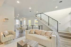 Living room with light hardwood / wood-style flooring