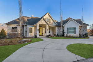 View of front of home with a front yard and a porch