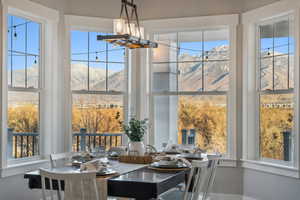 Dining room featuring a mountain view and a wealth of natural light