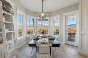 Dining room featuring a mountain view and an inviting chandelier