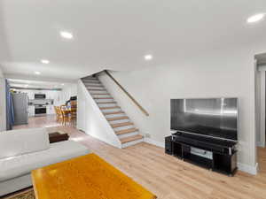 Living room with light hardwood / wood-style floors