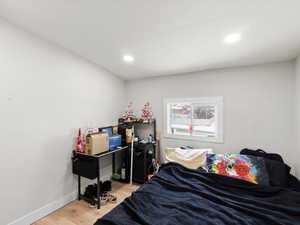 Bedroom featuring hardwood / wood-style flooring