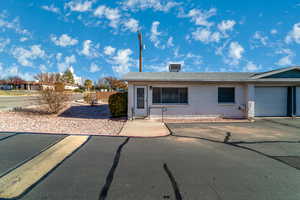 Ranch-style home featuring a garage