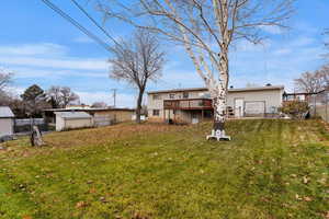 View of yard with a deck