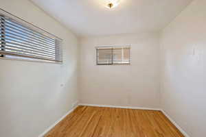 Unfurnished room with light hardwood / wood-style flooring and plenty of natural light