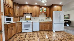 Kitchen featuring sink and white appliances