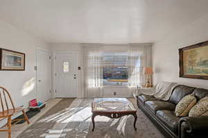 View of living room, window looks out to the south.