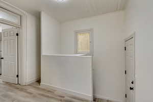 Unfurnished room with light hardwood / wood-style flooring