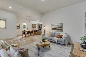 Living room featuring light hardwood / wood-style floors and a wealth of natural light