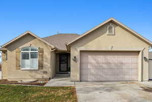 Single story home featuring a garage