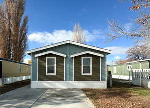 Rear view of house featuring a patio area