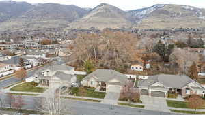 Birds eye view of property with a mountain view