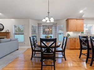 Dining room featuring light hardwood / wood-style floors and a notable chandelier