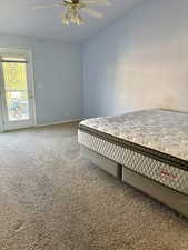 Bedroom with carpet floors, access to outside, and ceiling fan