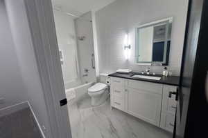 Full bathroom with vanity, toilet, and bathing tub / shower combination