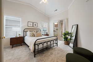 Carpeted bedroom with ceiling fan, ornamental molding, access to outside, and vaulted ceiling