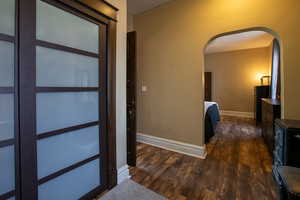 Corridor featuring dark hardwood / wood-style flooring