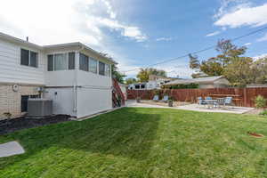 View of yard featuring a patio area and central AC