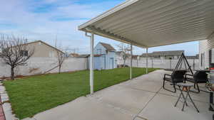 View of patio featuring a storage unit