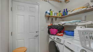 Laundry area featuring washer and clothes dryer