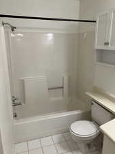 Full bathroom featuring tile patterned floors, vanity, shower / bathing tub combination, and toilet