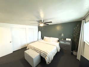 Carpeted bedroom with ceiling fan and multiple closets