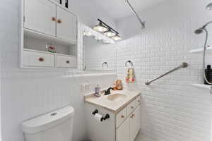 Bathroom with vanity and toilet