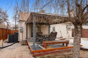 Back of house with a wooden deck