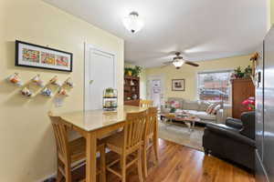 Dining area featuring hardwood / wood-style floors and ceiling fan