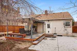 Rear view of property featuring a patio area