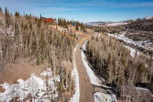 Snowy aerial view featuring a mountain view