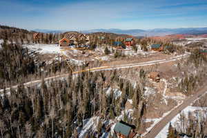 Snowy aerial view featuring a mountain view