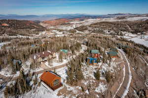 Snowy aerial view featuring a mountain view
