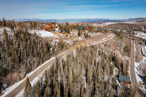 Snowy aerial view with a mountain view