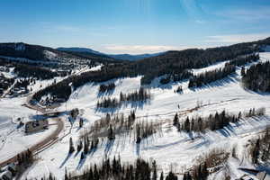 Snowy aerial view with a mountain view