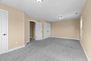 Unfurnished bedroom featuring carpet