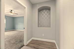 Hallway featuring hardwood / wood-style floors