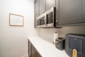 Walk in pantry with decorative backsplash