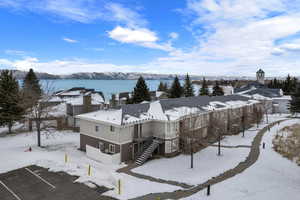 Snowy aerial view featuring a mountain view