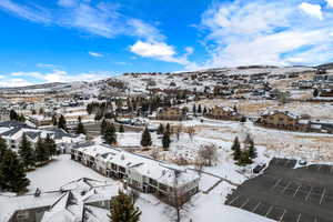 Snowy aerial view featuring a mountain view