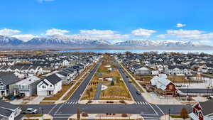 Birds eye view of property featuring a water and mountain view