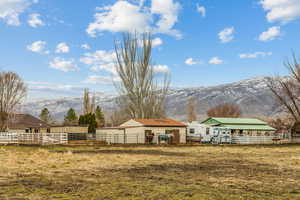 View of yard with a mountain view and a rural view